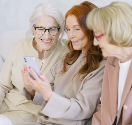 women on a video call on a phone